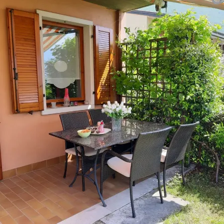 Apartment Agnese with lake view, swimming pool, garage and private garden.
