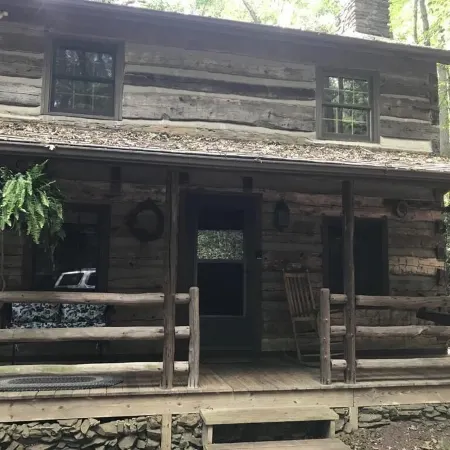 Come to the mountains to a rustic cabin by a creek.