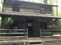 Come to the mountains to a rustic cabin by a creek.