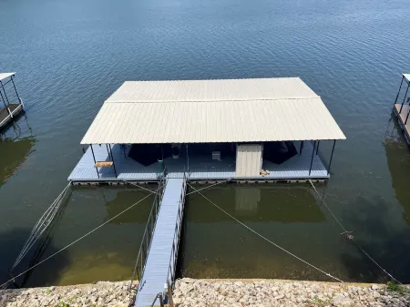 Lake house with three decks private dock and swim platform.