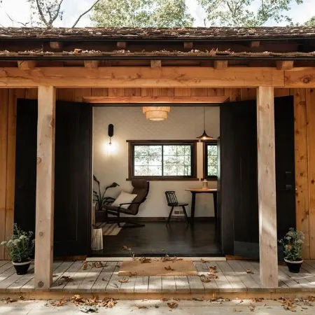 Japanese timberframe tiny house perched on side of Lookout Mountain