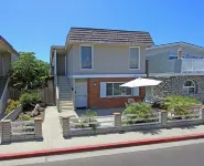 Spacious Living Area and Front Patio - Cozy Family Retreat