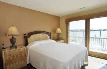 Waterfront Views and Private Deck - Charming Coastal Haven