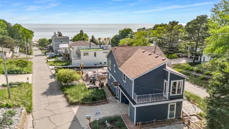 Peek-a-Boo Lake Views and Spacious Deck - Charming Beachside Retreat