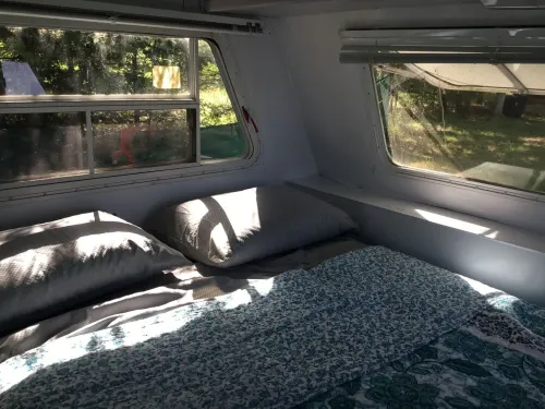Get lulled to sleep by Lake Superior in Vintage camper 5 steps from the water