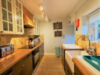 A Quaint Grade 11 Listed Detached Stone Cottage In Lower Slaughter with parking.