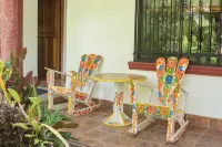 Private suite 102 with beautiful gardens, shared pool and BBQ area!
