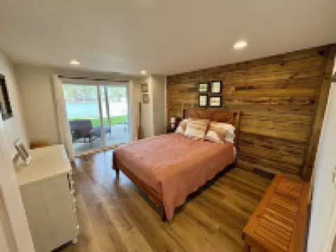 Spacious 7-bedroom, 5-bath home on 168' of a wide, deep-water cove.