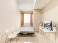 Cream Tone 1BR at Royal Sentul Park Apartment By Travelio