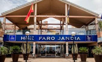 a hotel entrance with a blue and white sign above the door , indicating the name of the establishment at Mur Faro Jandia Fuerteventura & Spa