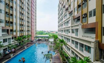Comfortable Pool View Studio Room at Gateway Park LRT City Bekasi Apartment