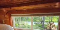 Near Pictured Rocks and trails, on the AuTrain River, has private hot tub
