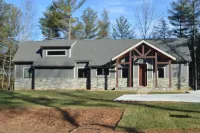 Lovely lakefront home with dock. Summertime stunner. Winter wonderland nearby.