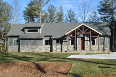 Lovely lakefront home with dock. Summertime stunner. Winter wonderland nearby.