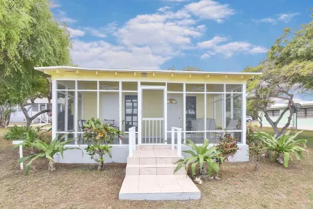 Buttercup Family Cottage beautiful beach, great snorkeling spot across the road