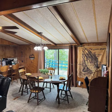 Quiet cabin in the woods w/ access to pools, river, & lakes in gated community!!