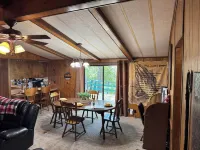 Quiet cabin in the woods w/ access to pools, river, & lakes in gated community!!