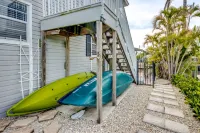 Tropical Oasis Pool Kayak Bikes fish from dock