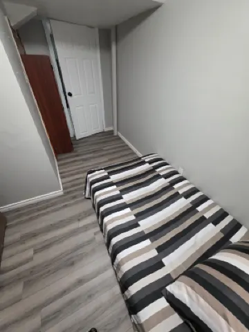 Bright & Cozy 2-Bedroom Main Floor Suite Hotels near Rose Theatre