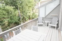 Steps from the pool and ocean! Four-level East Beach townhome with elevator!
