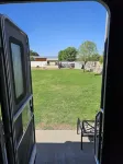 Cozy RV tucked back in a quiet property with plenty of room to relax