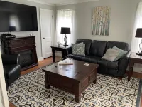 Rustic vintage cottage in Duck Cove with limited ocean view.