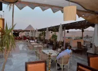 Al fouad palace and grand pyramids view