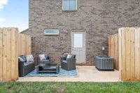 Full Kitchen, Outdoor Patio, and Large TVs - Modern Townhome Oasis Hotels in Clarksville