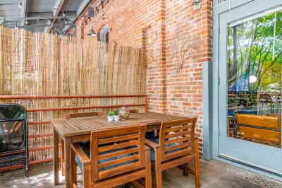100 Year-Old Historic Brick 2BR Loft & Large Patio & Hammocks & High Ceiling