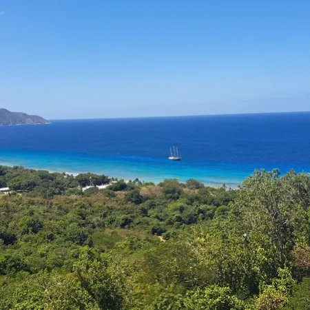 Quiet hillside villa with expansive sea, beach, and mountain views...