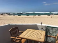 Cozy beachfront apartment with wonderful sunsets エル・コティージョのホテル