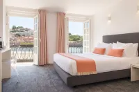 Miragaia Riverside Suites.