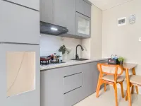 Soft Grey 1BR at Royal Sentul Park Apartment By Travelio