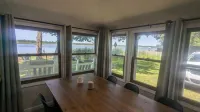 Charming 4-bedroom cottage ON Tawas Lake Pet, kid-friendly. Great Bird watching!