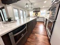 High-end home w/ fireplace, gourmet kitchen, sauna, game rm/ large yard/fire pit