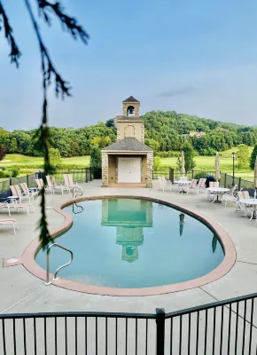 Nestled by the 7th green, large deck areas. Movie theatre for inside or out.