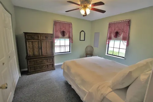 This charming  cozy cottage has a private hot tub, deck for fishing.