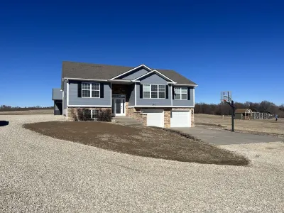 Country home with lake access and game room.