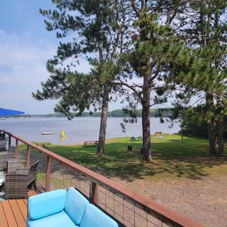 Rustic cabin getaway on the shore of Soo Lake in Phillips, WI