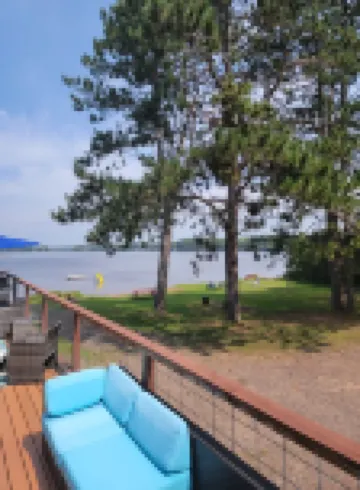 Rustic cabin getaway on the shore of Soo Lake in Phillips, WI