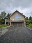 Charming Big Sky meadows house. Trails and Town Center a short walk away.