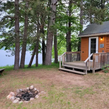 Rustic cabin getaway on the shore of Soo Lake in Phillips, WI