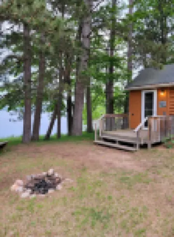 Rustic cabin getaway on the shore of Soo Lake in Phillips, WI