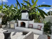 Malecon Beach House with beautiful backyard. Steps from the Caribbean ocean.