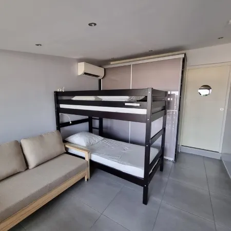 Facing the port, lovely studio on raised ground floor with large terrace, panoramic view