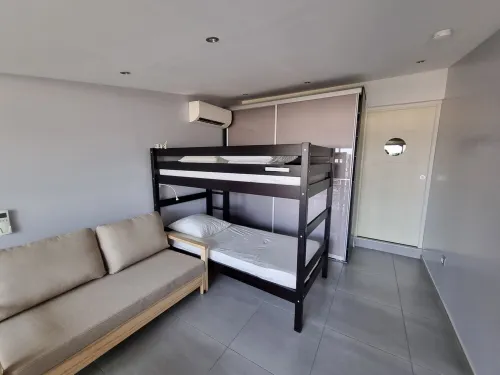 Facing the port, lovely studio on raised ground floor with large terrace, panoramic view