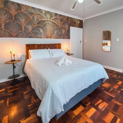 Tau Golden Mane Hotels near Norwood Mall