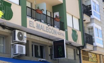 "a building with a sign that says "" el malec "" and an air conditioner on the side" at El Malecon