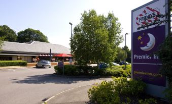 "a parking lot with several cars parked , and a building with a sign that reads "" premier inn "" on it" at Premier Inn Fareham
