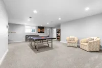 Family Friendly lake home, beach, level lot, fire pit, game room, dog friendly!